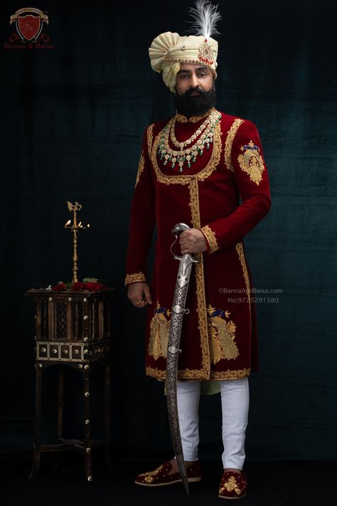 RED VELVET ANGRAKHA meticulously embroidered with pure RESHAM & JARDOSHI hand crafted thread work The Royal Outfit Accessoriesed by Safa made out of banarasi Silk paired with hand crafted Kundan work KALGI. And a hand-made Rajwadi Mojari with traditional Jardoshi work. For more such Royal Rajputana & Traditional outfits and Accessories please visit: www.bannaandbaisa.com Mo: 9725291580 Rajwadi Dress For Men, Rajwadi Sherwani For Groom, Angrakha Design, Dressing Sense For Men, Achkan For Men, Marriage Clothes, Best Wedding Dress Designers, Royal Outfit, Sherwani For Men Wedding