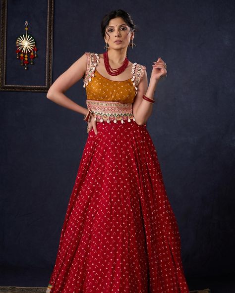 Indulge in the luxurious elegance of our Beautiful Red Bandhani Lehenga. Featuring intricate Mustard embroidery on the blouse and a matching Dupatta, this piece exudes sophistication and exclusivity. The Bandhani fabric adds a touch of artistry and charm, making it the perfect choice for a special occasion. Elevate your wardrobe with this statement piece. #sujatra #sujatraglobal #sujatralehenga #bandhani #bandhanilehenga #redlehenga #festivewear #lehengalove #rednmustard #luxelehenga Red Bandhani Lehenga, Lehenga Bandhani, Mustard Embroidery, Bandhani Fabric, Bandhani Lehenga, Padded Blouse, Red Lehenga, Charm Making, Embroidered Blouse