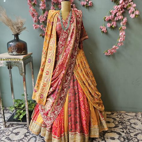 Discover the perfect blend of tradition and modernity with our latest ensemble at KKASHI Multidesigner Store! ✨ Featuring a breathtaking multi-kali lehenga crafted from Ikat, Bandhani, and pure raw silk, paired with a regal Patan Bandhej dupatta, embellished with exquisite zardozi work. We’ve also styled this look with a Kesariya orange Bandhani saree, beautifully woven with Shikarga animal motifs. Whether it’s a wedding, a festive celebration, or any special occasion, this look is sure to ... Mekhla Chadar Saree, Mekhla Chadar, Kali Lehenga, Bandhej Dupatta, Bandhani Dupatta, Choli Dress, Zardozi Work, Animal Motifs, Bandhani Saree