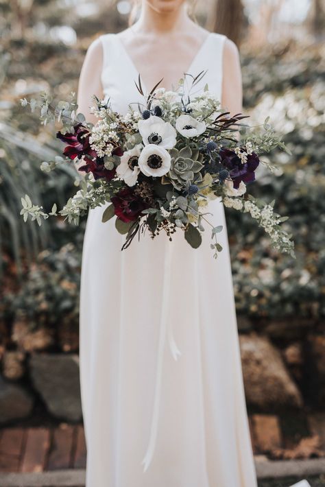 Bridal bouquet with eucalyptus, spirea, anemone, succulent, thistle, agonis | Flora Boh | Jill Houser Photography Bridal Bouquet With Eucalyptus, Bouquet With Eucalyptus, Elegant White Wedding, Modern Fairy, Anemone Bouquet, Earthy Vibes, Succulent Bouquet, White Anemone, Winter Bouquet