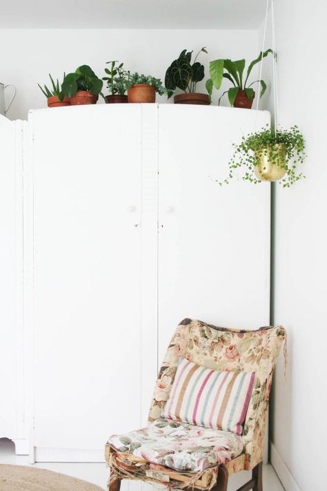 Styling the Seasons - June | Apartment Apothecary | Plants in the bedroom | Wardrobe plants  | Antique nursing chair Top Of Wardrobe Decor, Wardrobe Decor, Bedroom Makeover Before And After, Wardrobe Makeover, Vintage Bedroom, White Furniture, Minimalist Living, Contemporary Bedroom, The Seasons