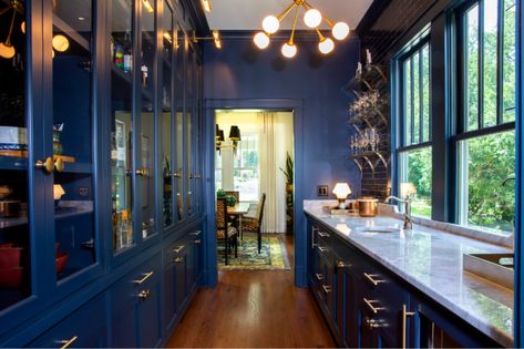 This navy butler's pantry with gold accents and glass floating shelves is not only a center for entertaining but a favorite spot to relax and whip up craft cocktails. Navy Butlers Pantry, Pantry Blue, Antique Mirror Tiles, Home Wet Bar, Floating Glass Shelves, Home Bar Design, Renovation Inspiration, Indoor Bar, Butlers Pantry