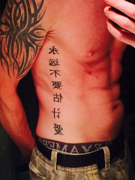 Obliques Tattoo For Men, Vertical Rib Tattoo Men, Mens Patchwork Tattoo Ideas Arm, Chinese Rib Tattoo, Men Torso Tattoo, Side Of Chest Tattoo, Kanji Tattoo Men, Side Tattoos For Men Ribs, Mens Rib Tattoo Ideas