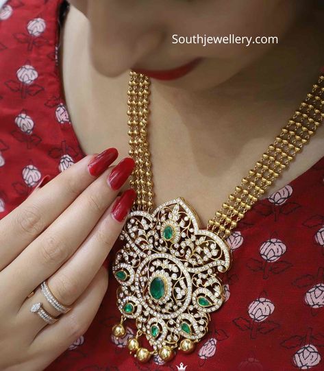 22k gold four line gold balls necklace with closed setting diamond emerald pendant by Raj diamonds, Bangalore.  gundu mala with pendant Long Haram, Necklace With Diamond, Diamond Pendants Designs, Gold Jewelry Simple Necklace, Diamond Pendant Sets, Beautiful Gold Necklaces, Diamond Necklace Designs, Gold Necklace Indian Bridal Jewelry, Gold Pendant Jewelry