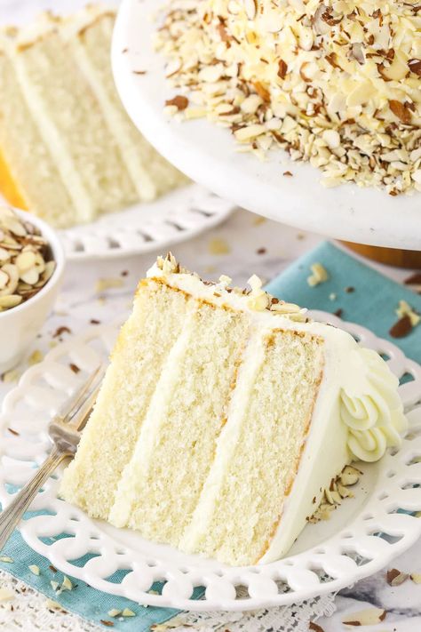 This Almond Cream Cake is a tender, velvety and moist almond cake that's covered in a whipped cream cheese almond frosting! Almond Paste Cake, Almond Wedding Cake Recipe, Almond Cream Cake Recipe, Moist Almond Cake, Almond Cream Cake, Almond Wedding Cake, White Almond Cakes, Almond Wedding Cakes, Life Love And Sugar