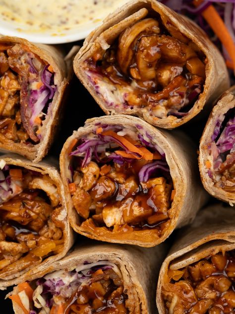 Chicken wrap filled with juicy made from scratch BBQ Chicken, crunchy veggies, cheese, and a mustard mayo sauce. These BBQ Chicken Wrap makes for a filling and nutritious meal that’s perfect to pack for lunch and a quick grab and go meal. Meet our favorite summer lunch!! Tender BBQ chicken breast, crunchy coleslaw, red onion,... Bbq Chicken Wraps Healthy, Barbecue Chicken Wrap, Mustard Mayo Sauce, Bbq Chicken Pita, Easy Chicken Wrap, Baked Bbq Chicken Recipes, Crunchy Coleslaw, Chicken Wraps Healthy, Chicken Thigh Seasoning