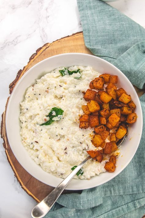 Curd Rice, often called Thayir Sadam in Tamil, is a staple and comforting South Indian dish known for its cool, tangy, and creamy texture. Serve this Indian yogurt rice with pickle or podi or a side of potato fry and papad to make a filling yet light to stomach meal for summer days. Tamil Recipes, Curd Rice Recipe, Yogurt Rice, Indian Yogurt, Cheap Meal Prep, Potato Fry, Curd Rice, Comforting Food, South Indian Recipes