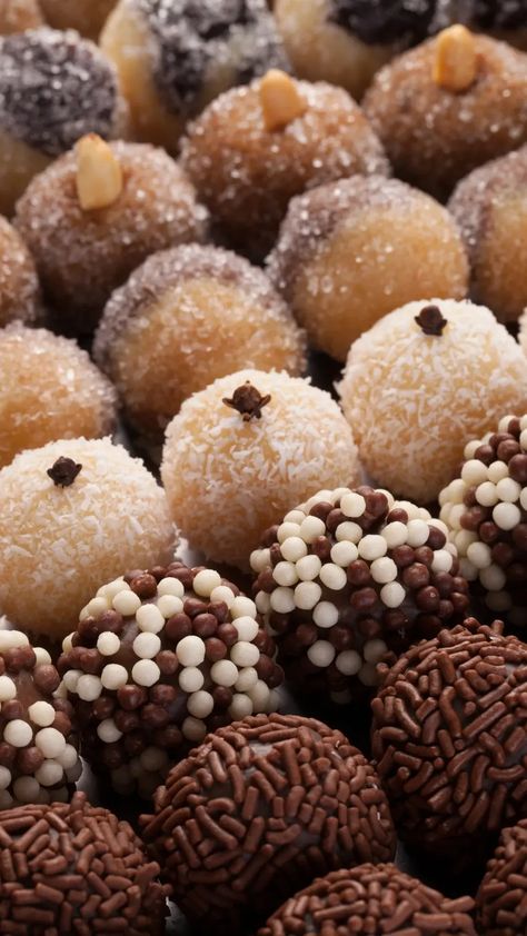 How To Make Beijinho: Brazilian Coconut And Condensed Milk Balls Condensed Milk And Coconut Balls, Brazilian Coconut Balls, Coconut Candy Recipe Condensed Milk, Condensed Milk Balls, Coconut Ball, Milk Balls, Brazilian Desserts, Coconut Balls, Coconut Candy