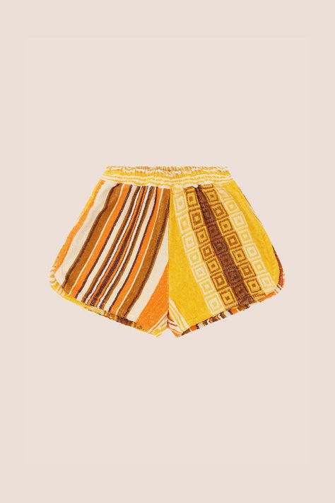 UNO DI UNO - 031 ~ Estate Shorts Relax into an endless summer with the original Estate Shorts, inspired by ‘70s resort attire. A signature Terry style, the Estate Shorts have a classic silhouette with a distinct wide hem and side splits. Crafted from up-cycled vintage towelling sourced from around the world, each pair of shorts are individually handmade in Australia, making it a truly Uno di Uno style. Wear with the Bespoke Estate Shirt for a one-of-a-kind look that goes from sunbathe to sunset. Resort Attire, Towel Dress, Vintage Towels, Terry Towel, Towel Sizes, Side Splits, Vintage Beach, Endless Summer, Classic Silhouette