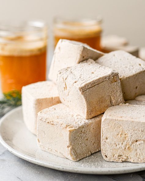 Soft, pillow like marshmallows that taste like fall! Made with fresh apple cider for a tart, sweet taste. No corn syrup marshmallows here, these have brown sugar and honey and are dusted in a mix of cinnamon and organic powdered sugar. All you need is a pot, a thermometer and a stand mixer! Vanilla Marshmallows, Homemade Apple Cider, Homemade Marshmallows, Sheet Cake Pan, Hot Apple Cider, Marshmallow Fluff, Animal Crackers, Soft Pillow, Fresh Apples