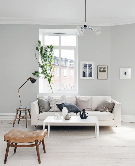 Light grey home with a mix of old and new - via cocolapinedesign.com Blue Paint Living Room, Grey Couch Decor, Grey Walls Living Room, Grey Couch Living Room, Minimalist Living Room Decor, House Paint Interior, Light Grey Walls, Couch Decor, Trendy Living Rooms