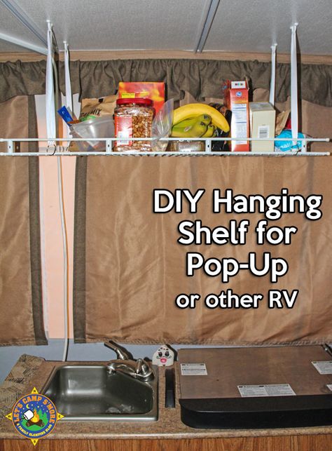 Simple DIY Hanging Shelf Hack for a Pop-Up Camper - Make this simple hanging shelf with an old wire shelf and a few other inexpensive items. It helps you keep the trailer organized. #popup #mod #RV Diy Hanging Shelf, Jayco Pop Up Campers, Tent Trailer Remodel, Tent Trailer Camping, Pop Up Campers, Popup Camper Remodel, Pop Up Tent Trailer, Pop Up Trailer, Camping Diy