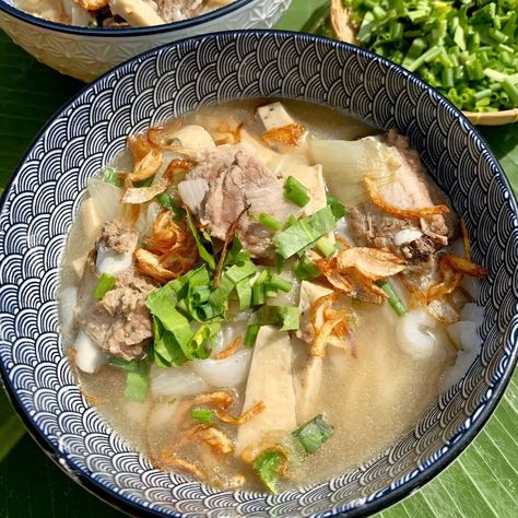 This khao piak sen recipe is hands down the best Lao noodle soup you’ll ever try! It’s got the most flavorful pork (or chicken) broth, thick homemade tapioca noodles that are ridiculously slurpable, and endless options for fresh herbs and toppings. Lotus Flower Cookies, Flower Cookies Recipe, Khao Piak, Pork Noodle Soup, Laos Food, Soup Broth, Homemade Noodles, Fried Shallots, Garlic Fries