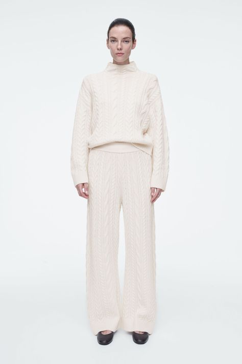 CABLE-KNIT WOOL PANTS - IVORY - Trousers - COS Casual Sporty Outfits, Belted Cape, Knit Trousers, Knitted Suit, Matching Sweaters, Funnel Neck Sweater, Cardigan Shirt, Wool Vest, Wool Trousers