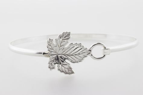 Handcrafted Sterling Silver Bangle Bracelet featuring a beautiful Maple Leaf design. Another classic, the Maple Leaf is a wonderful addition to celebrate the fall season. Handcrafted All Sterling Silver Maple Leaf Bangle Bracelet. Proudly Made In USA. Maple Leaf Bracelet, Maple Leaf Design, Silver Maple Leaf, Silver Bangle Bracelet, Sterling Silver Bangle Bracelets, Leaf Bracelet, Sterling Silver Bangle, Sterling Silver Bangles, Silver Bangle