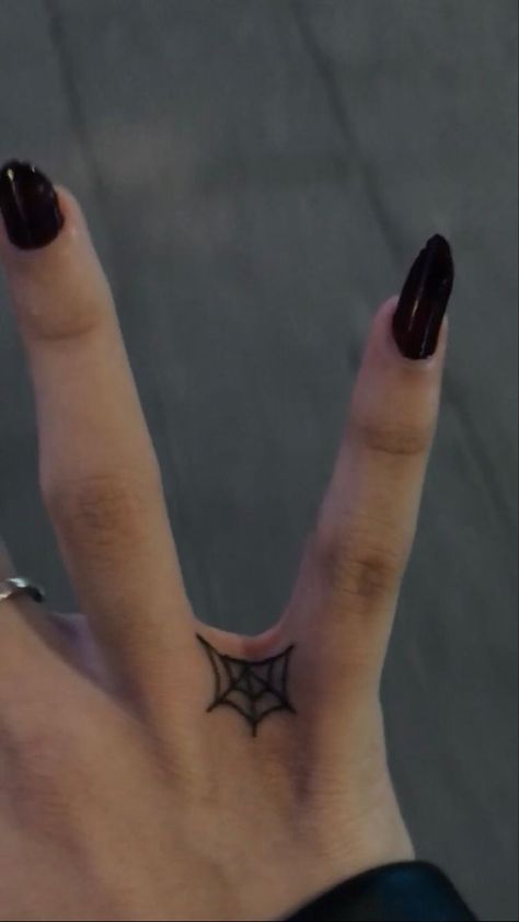 If you're looking for some inspiration for your next tattoo, or just want to see some of the most creative and well-done pieces out there, the subreddits r/tattoo and r/tattoos are the perfect places to start. Cool Simple Hand Tattoos, Finger Tattoos Spider Web, Small Witchy Hand Tattoos, Finger Web Tattoo, Simple Alt Tats, Small Goth Tattoo Ideas Simple, Web Finger Tattoo, Knuckle Word Tattoos For Women, Between Finger Tattoos For Women