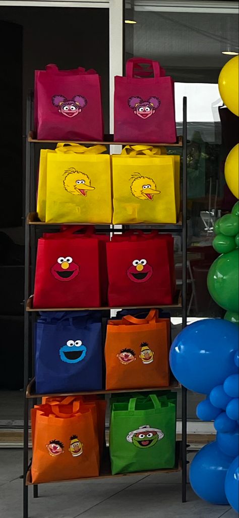 DIY sesame street goodie bags. Affiliates link to bags. You can purchase a svg of characters for 1 dollar on etsy and print out the labels on the cricut. #sesamestreetparty #sesamestreet #elmobirthdayparty #elmo #birthdaydecoration #sesamestreetcenterpiece #1stbirthday #goodiebags #favorbags #favors Sesame Street Party Favors Goody Bags, Sesame Street Candy Bags, Elmo Candy Bags, Sesame Street Goodie Bags, Sesame Street Centerpiece, Sesame Street Party Favors, Bday Stuff, Birthday Party Home, Elmo Birthday Party