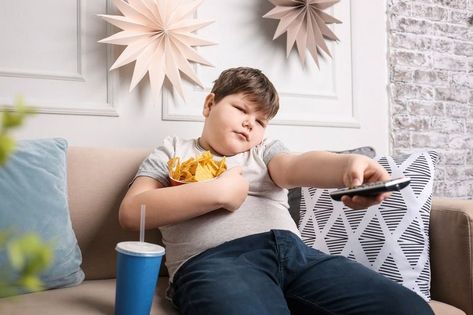 overweight boy on sofar with TV remote and chips | childhood obesity Abdomen Plat, Kapha Dosha, Ayurvedic Clinic, Gastrointestinal System, Childhood Obesity, Poor Children, Kids Diet, Low Self Esteem, Rich Kids