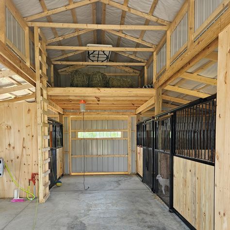 Another beautiful monitor barn completed for a customer in Apple Creek, Ohio! It is 30'x26' and has (3) 10x10 stalls, a 6x10 tack/feed room, 10x10 loft, and a cupola! 🐴🐃🐐🐎🐑🐕🐕‍ ktbarns.com Small Arenas Horse, Feed Room Horse, Tack And Feed Room Ideas, Barn Stall Ideas, Feed Room Ideas Barn, Tack Room Ideas, Horse Feed Room, Pole Barn Interior, Metal Horse Barns