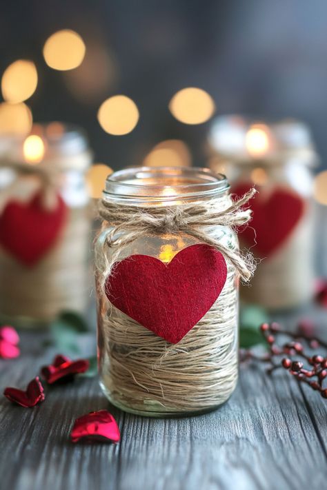 Get ready to spread the love with these 30 Stunning Valentine’s Day Mason Jar Ideas You’ll Love! Perfect for gifts, decorations, or fun crafts, these ideas transform simple jars into romantic treasures. Create candlelit mason jar lanterns, layered candy jars, or DIY love notes in a jar to show someone you care. Add a festive touch with painted hearts, sparkling glitter accents, and rustic twine bows. Use them as centerpieces, treat holders, or flower vases to elevate your Valentine’s Day celebra Valentine Mason Jar Crafts, Valentine Lantern Ideas, Simple Valentine Table Centerpieces, Mason Jar Valentines Ideas Diy Gifts, Valentine’s Day Diy Craft, Diy Valentine Centerpieces, Lantern Ideas Diy, Love Notes In A Jar, Tiny Jar Crafts