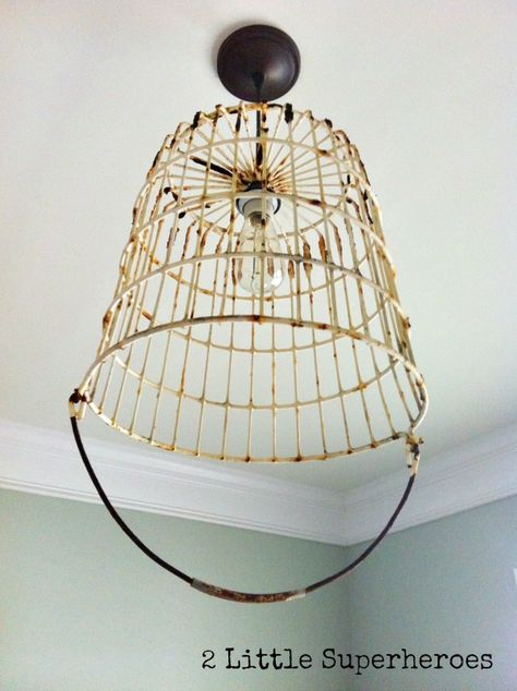 You can find these old egg baskets at any flea market or antique store for about $25. And they have the perfect size hole in the bottom. I took a $20 mini penda… Diy Egg Basket, Ceiling Lights Diy, Basket Light, Diy Light Fixtures, Outdoor Chandelier, Basket Lighting, Amazing Decor, Egg Basket, Diy Basket