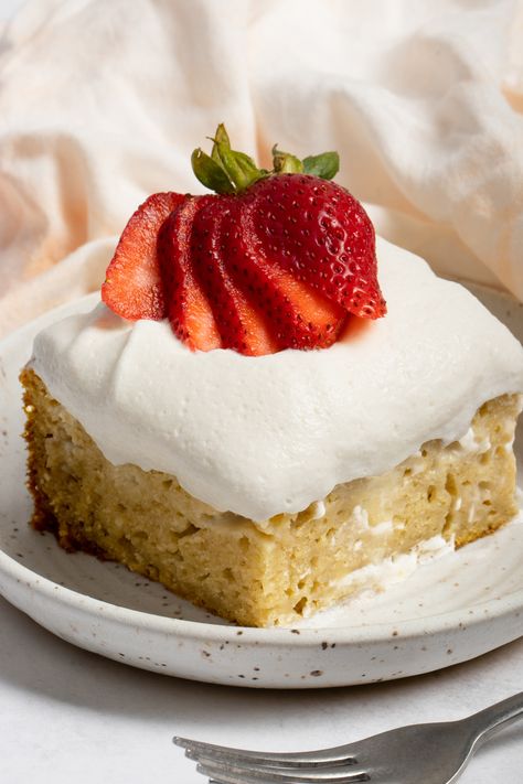 This light and fluffy Vegan Tres Leches Cake is a super easy and absolutely delicious dessert. The simple and light cake recipe is easy to bake, and it is even easier to add the vegan three milks mixture and light fluffy whipped cream (also vegan) on top for a gorgeous presentation. Vegan Tres Leches Cake, Strawberry Tres Leches Cake, Strawberry Tres Leches, Lemonade Cake Recipe, Pineapple Poke Cake, Vegan Condensed Milk, Lemonade Cake, Vegan Whipped Cream, Light Cakes