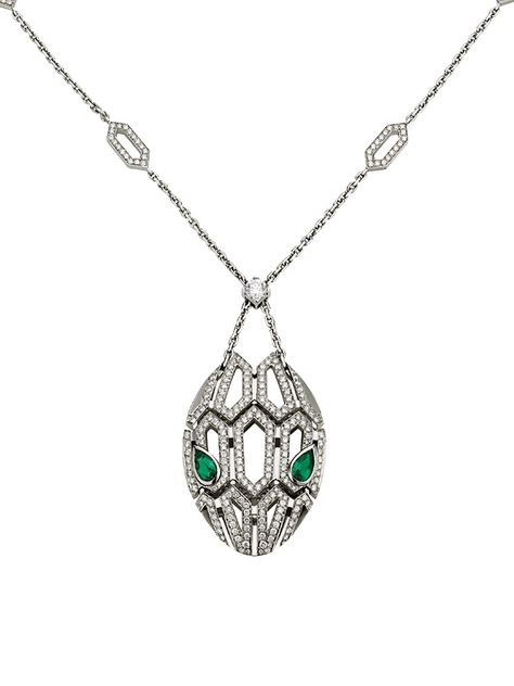 From the Serpenti Seduttori Collection. Capturing the snake's innate power of attraction, the Serpenti pendant glorifies the head of the mythical animal, focusing on the magnetic power of the eyes. A striking diamond station necklace cast in gleaming 18K white gold with emerald eyes and pavé diamonds. Diamonds, 2.63 tcw Emeralds, 0.96 tcw 18K white gold Lobster clasp Made in Italy SIZE Adjustable length, about 16.9"-17.7" ABOUT THE BRAND Founded in Italy in 1884 by Greek silversmith Sotirio Bulg Bvlgari Necklace Snake, Bvlgari Necklace, Emerald Pendant Necklace, Power Of Attraction, Emerald Necklace Pendant, Bvlgari Serpenti, White Gold Pendant Necklace, Emerald Eyes, Mythical Animal