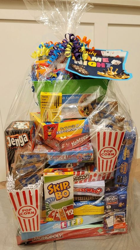 Themed Basket For Raffle, Board Games Basket Ideas, Diy Family Game Night Gift Basket, Game Night Silent Auction Basket, Gift Baskets To Raffle Off, Family Fun Basket Ideas, Classroom Auction Basket Ideas, School Raffle Ideas, Family Game Gift Basket Ideas