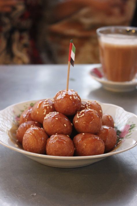 This traditional Emirati dessert called Luqaimat is a must try while in Dubai. Wheat baked balls with spices such as cardamon and saffron topped with date syrup. yum! Emirati Food, Dates Syrup, Ramadan 1, Menu Planning, Arab Emirates, Dessert Ideas, Pretzel Bites, Traditional Food, Fun Desserts