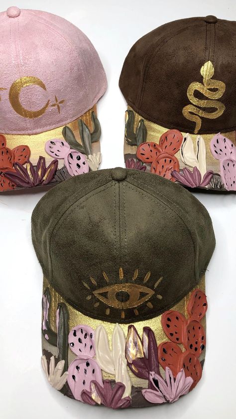 beyondthe.canvasbyyaya on Instagram: More caps coming soon! 🥰 which one stood out to you?! #hat #fedora #floralhat #floralart #baseballcap #handpaintedhats #fedora… Hat Design Ideas, Painting Denim, Textured Hat, Redo Clothes, Wolf Hat, Pink Patch, Hat Fedora, Painted Hats, Boho Hat