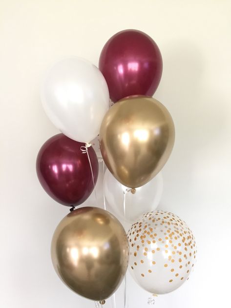 Burgundy, white and gold balloons! These balloons are the perfect way to make a pop at your next event! This (8-count) Burgundy and Gold Balloon Bouquet includes:2 Burgundy Latex 11 Balloons2 White Latex 11 Balloons2 Clear with Gold Dots Latex 11 Balloons 2 Chrome Gold Latex 11 Balloons*For more fu Burgundy Balloons, Burgundy Birthday, Blush Balloons, Quinceanera Decorations, Maroon Wedding, Deco Rose, Bridal Shower Decor, Gold Bridal Showers, White Balloons