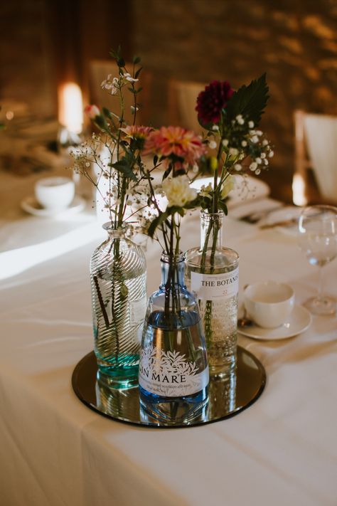 Flowers on table in recycled gin bottle Wedding Photo Table, Wedding Table Decoration, Bottle Centerpieces, Gin Bottle, Wedding Bottles, Gin Bottles, Flower Vase, Table Decoration, A Flower