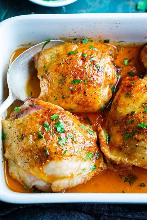 Crispy oven baked chicken thighs recipe using bone-in, skin-on chicken thighs. 5 minute prep, deliciously juicy, crispy, and family-approved!