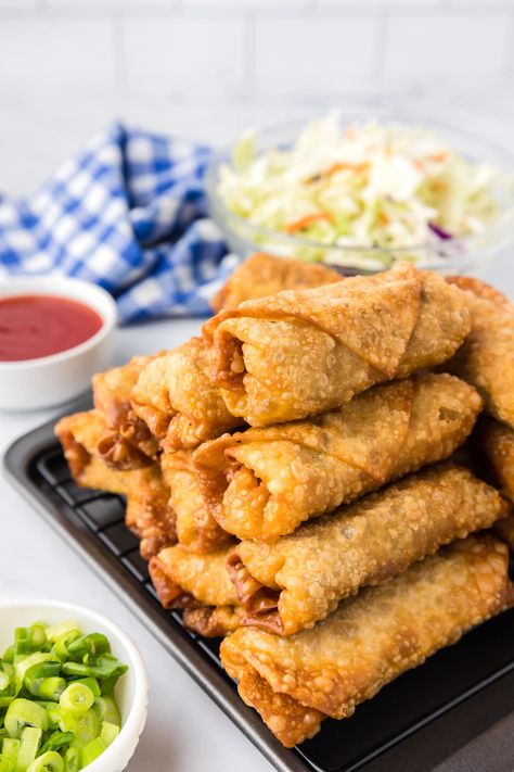 If you have a Chinese food craving, this recipe for homemade Egg Rolls will hit the spot. They are easy to make and super crispy on the outside while remaining juicy and flavorful on the inside. This easy egg roll recipe will make you rethink ordering takeout. Egg Rolls Aesthetic, Egg Roll Aesthetic, Easy Egg Roll Recipe, Pork Egg Roll Recipes, Easy Egg Roll, Chinese Egg Rolls, Egg Roll Recipe, Food Portfolio, Homemade Egg Rolls