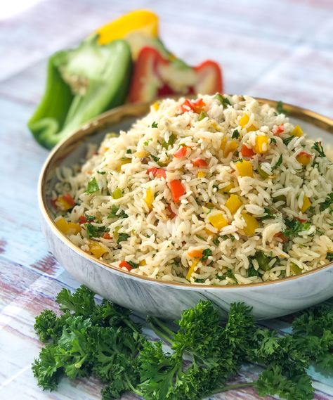 Bell Pepper & Parsley Rice Recipe is a super simple recipe of a yummilicious stir fried continental rice. Rice is cooked along with some roasted garlic, onions and a hint of rosemary.  The pre cooked rice is then tossed with pan roasted peppers and some fresh parsley. Great to be served with conti dishes or use it as am element for casseroles.  Serve Bell Pepper & Parsley Rice Recipe along with Herbed Vegetables In Roasted Bell Pepper Sauce Recipe or Roasted Parsley Rice Recipe, Bell Pepper Rice Recipe, Bell Pepper Sauce Recipe, Parsley Rice, Herbed Rice, Ground Beef Breakfast, Cilantro Lime Rice Recipe, Garlic Mashed Potatoes Recipe, Lime Rice Recipes