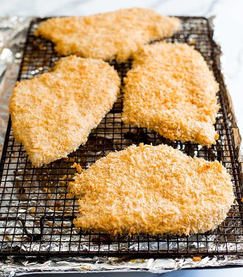 These Crispy Oven Baked Chicken Schnitzels are a healthy alternative to your deep-fried schnitzel. Perfect when you are craving fried comfort food but want a healthier option. Whether you are serving these with a salad, mash or in a bun for a sandwich, these crispy, juicy and extra crunchy schnitzels are perfect! Learn how to get an oven-baked Schnitzel that’s extra crunchy! A healthy twist on a family favorite! Baked Chicken Schnitzel, Chicken Snitzel Recipe, Easy Chicken Schnitzel, Air Fryer Chicken Schnitzel Recipe, How To Make Chicken Schnitzel, Chicken Shnitzel, Oven Baked Chicken Schnitzel, Baking Frozen Chicken, Perfect Baked Chicken