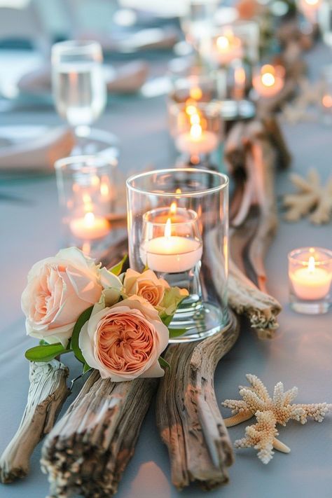 Add a unique, organic touch to your wedding decor with driftwood centerpieces. See more ideas here. Driftwood Wedding Table Decor, Fall Beach Theme Wedding, Natural Wood Centerpieces, Driftwood Centerpiece Ideas, Beachy Wedding Table Decor, River Wedding Decor, Sea Glass Wedding Centerpieces, Fall Ocean Wedding, Driftwood Centerpiece Wedding