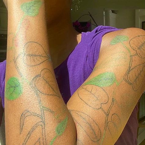 43 Color Tattoos On Dark Skin That Will Inspire Your Next Appointment — See Photos | Allure Botanical Tattoo Dark Skin, Green Tattoo On Brown Skin, Healed Color Tattoos On Dark Skin, Green Tattoo On Dark Skin, Blue Tattoo On Brown Skin, Colored Tattoos On Brown Skin, Color Tattoos On Dark Skin, Green Tattoo Ink, Tattoos On Brown Skin