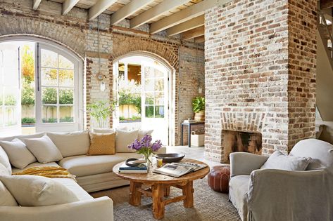 Carriage House Living Room by Architect Heather A. Wilson Spanish Design, Exposed Brick Walls, Deco Boheme, Dining Chair Slipcovers, Brick Fireplace, Carriage House, Elegant Interiors, Modern Farmhouse Decor, Exposed Brick