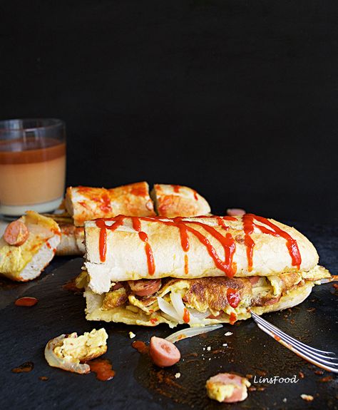 Roti John recipe, a favourite baguette sandwich from Singapore. Singaporean Recipes, Malaysian Breakfast, Roti John, Omelette Sandwich, Bread Omelette, Onion Sandwich, Malay Recipes, Deep Fried Bananas, Chicken Pies