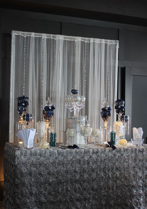 This is visually stunning but not accessible.  All the candy will still be in the jars at the end of the evening. Blue And Silver Dessert Table, Silver Dessert Table, Baby Shower Table Set Up, Blue Candy Buffet, Wedding Toms, Candy Buffet Wedding, Candy Buffet Tables, Candy Bar Wedding, Candy Station