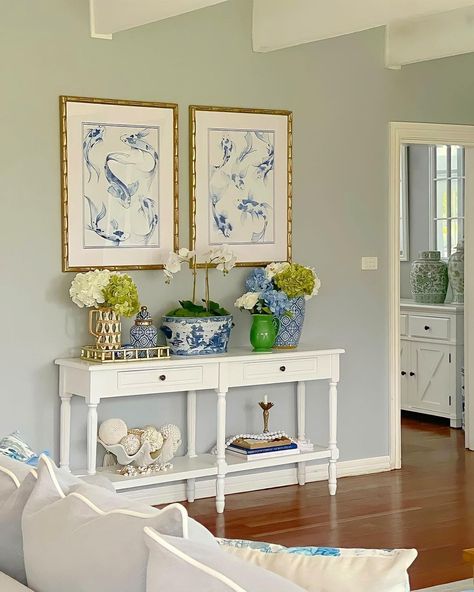 Millennial House Decor, Grandmillenial Style Entryway, Costal College Apartment, Grandmillenial Hallway, How To Decorate With Blue And White, Grandmillenial Console Table, Grand Millennial Entry Table, Grand Millennial Mantle, Grandmillenial Fireplace Decor