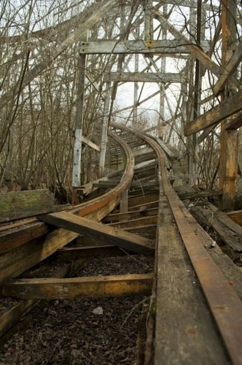 Old roller coaster  There was an old wooden roller coaster like this in Canton, Ohio where Terry and his brothers grew up during high school.  He spent a lot of time there.  When visiting Canton one year we stopped by the park, it was closed down then, and found a piece of the coaster and kept it for a souvenier.  I still have it put away .  nana Wooden Roller Coaster, Abandoned Theme Parks, Abandoned Amusement Park, Magic Places, Abandoned Things, Abandoned Train, Abandoned Amusement Parks, Last Ride, Parc D'attraction