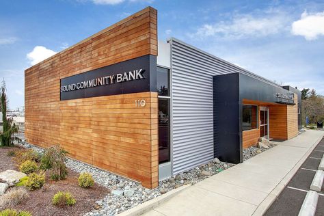 From Burger King to bank.  We stripped the abandoned fast-food building down to the slab and worked off of the existing footprint.  This high-end branch intr... Mid Century Modern Commercial Buildings, Metal Building Designs, Retail Facade, Retail Architecture, Wood Facade, Factory Architecture, Prototype Design, Bank Design, Wood Architecture