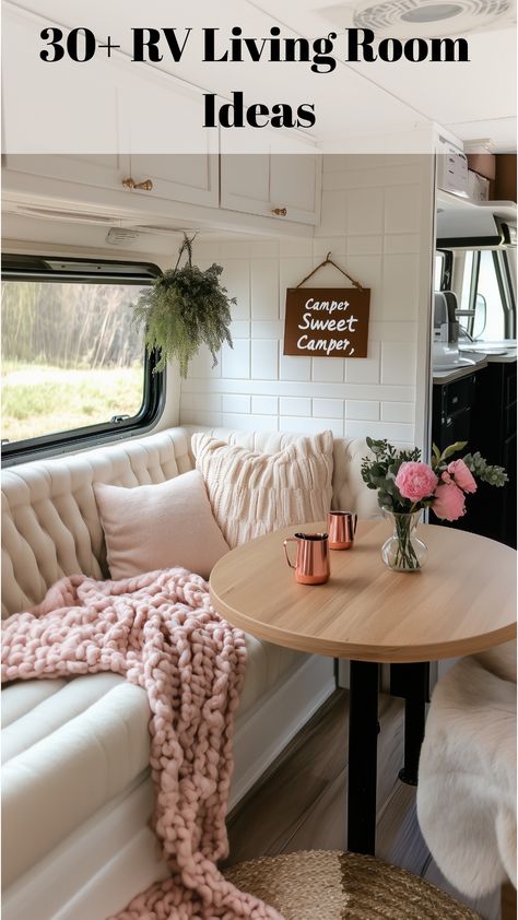 A cozy RV living room featuring plush seating and fluffy throws, complemented by a rustic wood table. Soft blue cushions and textured blankets enhance the welcoming atmosphere, while large windows allow ample natural light, creating an airy space ideal for cold-weather travels or relaxing evenings on the road. Rv Living Room Ideas, Rv Furniture Ideas, Cute Rv, Rv Living Room, Rustic Wood Table, Rv Furniture, Rv Interior Remodel, Camper Interior Design, Textured Blankets