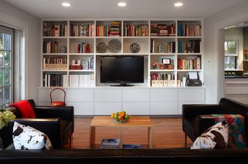 10 Great Home Projects and What They Cost - Forbes Contemporary Family Rooms, Wall Tv Stand, Bookshelves With Tv, Ruang Tv, Contemporary Family Room, Tv Fal, Cozy Family Rooms, Flat Screen Tv, Bookshelf Design