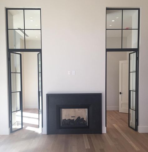 Fireplace Between Two Patio Doors, Double Faced Fireplace, Dual Side Fireplace, Fireplace Between Two French Doors, Fireplace With Doorway On One Side, Double Sided Fireplace Bathroom, Double Sided Fireplace Living Room Ideas, Door Beside Fireplace, Fireplace With Door On One Side