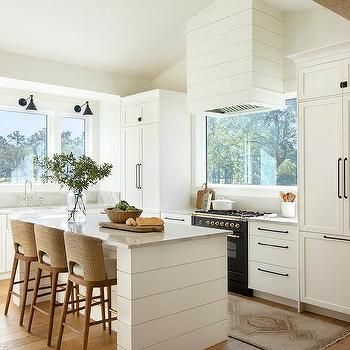 White Cottage Kitchen, White Kitchen Counters, White Shiplap Wall, Kitchen Counter Stools, Black Kitchen Cabinets, White Shiplap, Stoves Range, Kitchen Hoods, White Marble Countertops