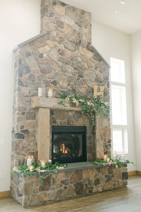 Fireplace Background Wedding, Fireplace Decor For Wedding, Wedding In Front Of Fireplace, Decorate Fireplace For Wedding, Wedding Mantle Decor Fireplaces Rustic, Wedding Photo Backdrop Fireplace, Stone Fireplace Wedding Decor, Fireplace Wedding Ceremony Winter, Mantle Wedding Decor