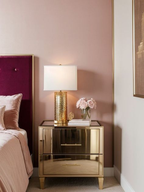 Create a luxurious atmosphere in your bedroom with a stunning pink accent wall. Complete the look with a plush velvet headboard and sleek gold bedside tables for a touch of elegance. Pink Accent Wall, Pink Accent Walls, Velvet Headboard, Art Interior, Pink Accents, Bedside Tables, Dream Bedroom, Interior Art, Bedside Table